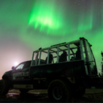 Arctic truck under the northern lights